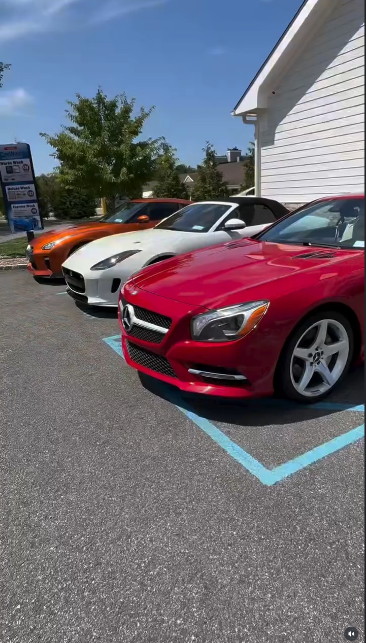 Luxury car lineup at Vista Hand Wash featuring Mercedes-Benz, Jaguar and sports cars in professional parking spaces